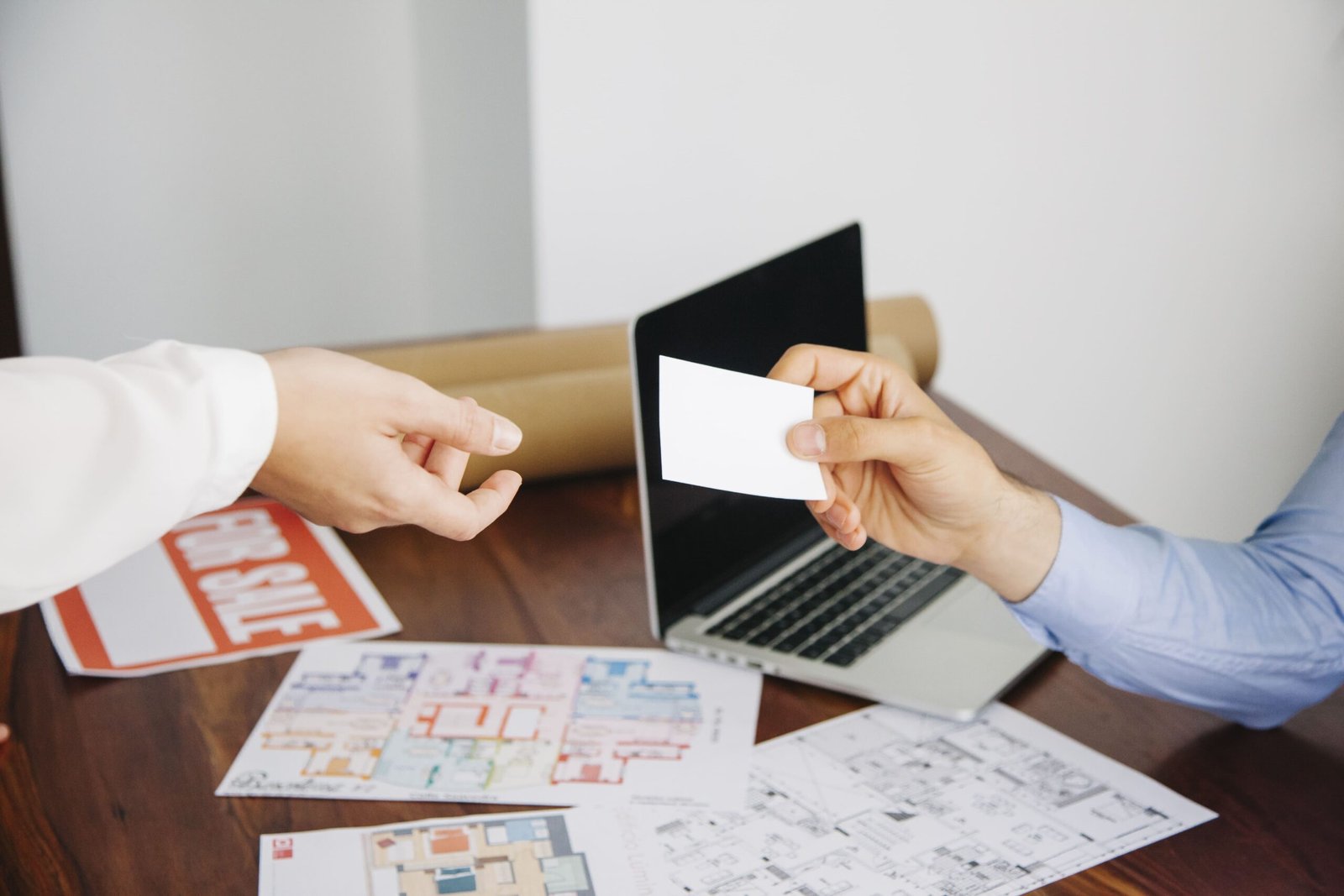 real estate workers with business card (1)